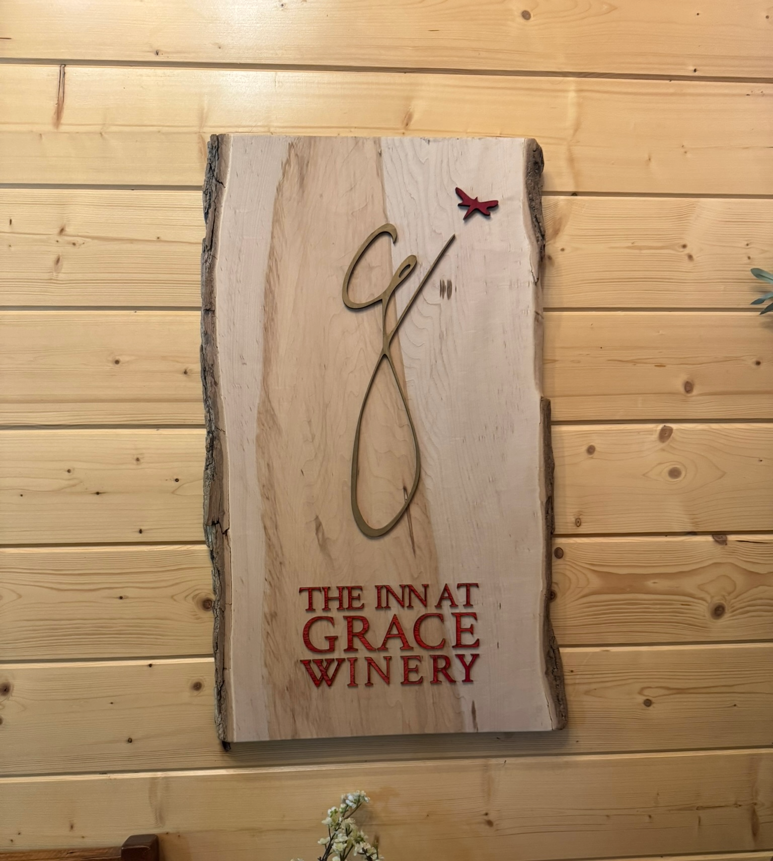 Wooden Inn at Grace Winery sign inside the historic barn in Glen Mills, Pennsylvania.